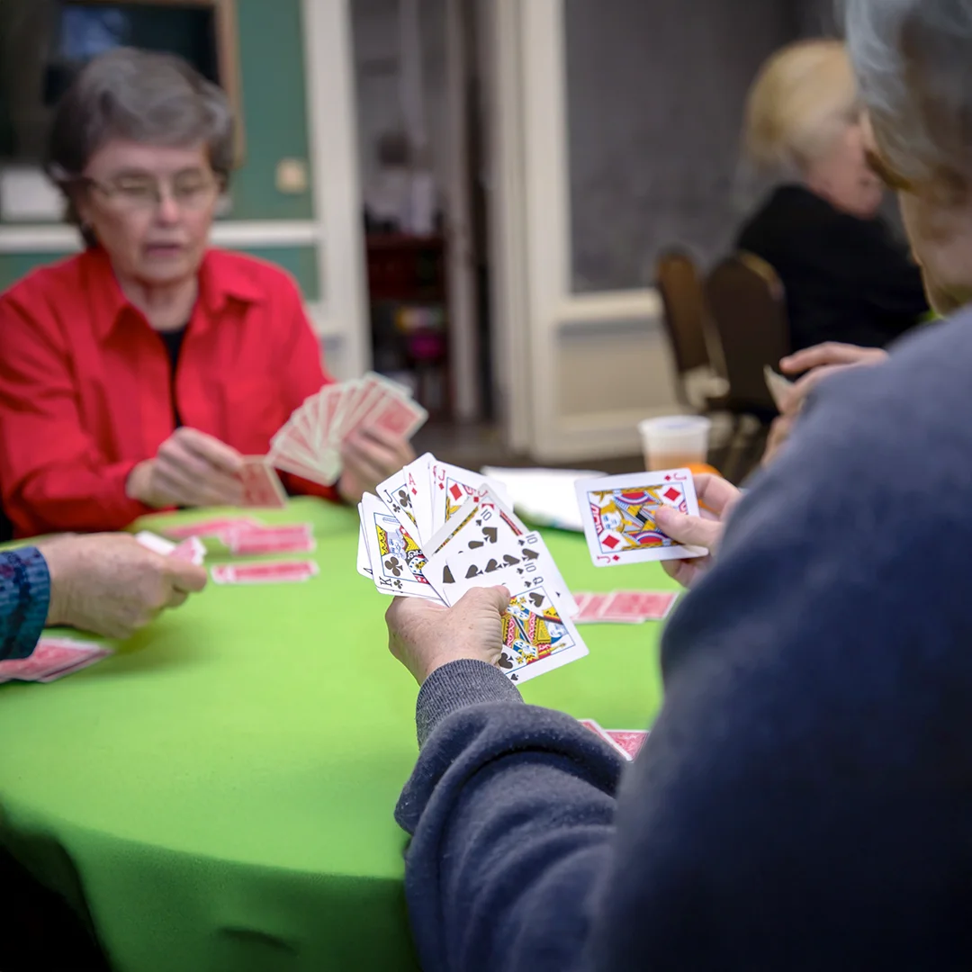 People playing cards at a table