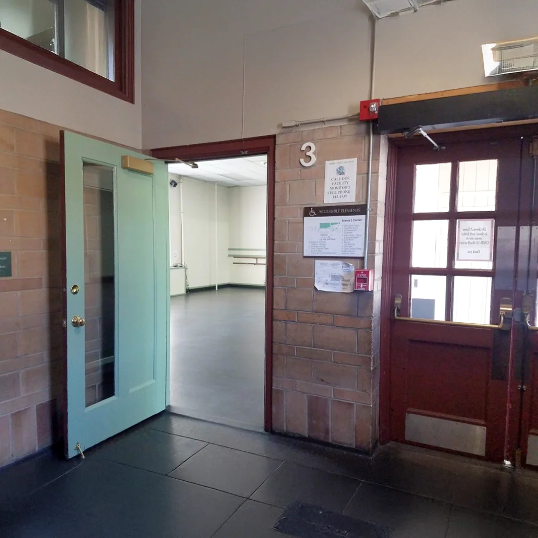 Empty studio with green door entrance