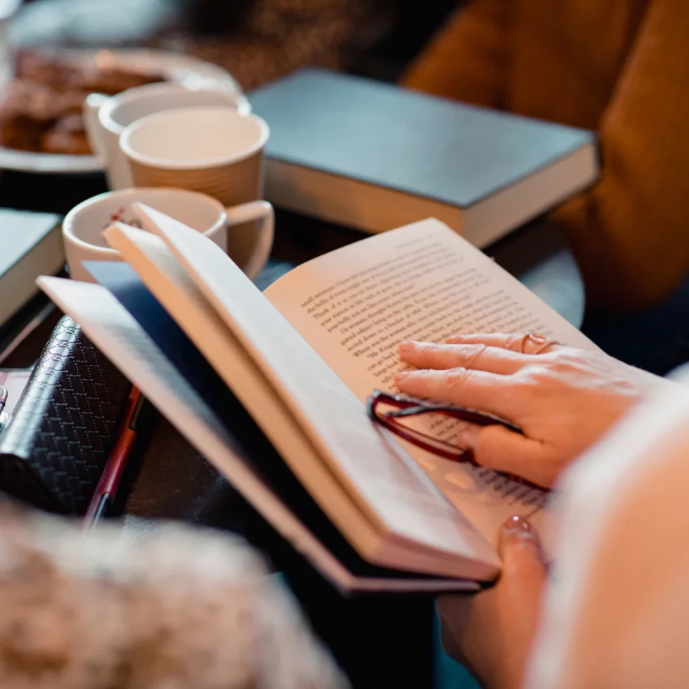 Hands holding an open book