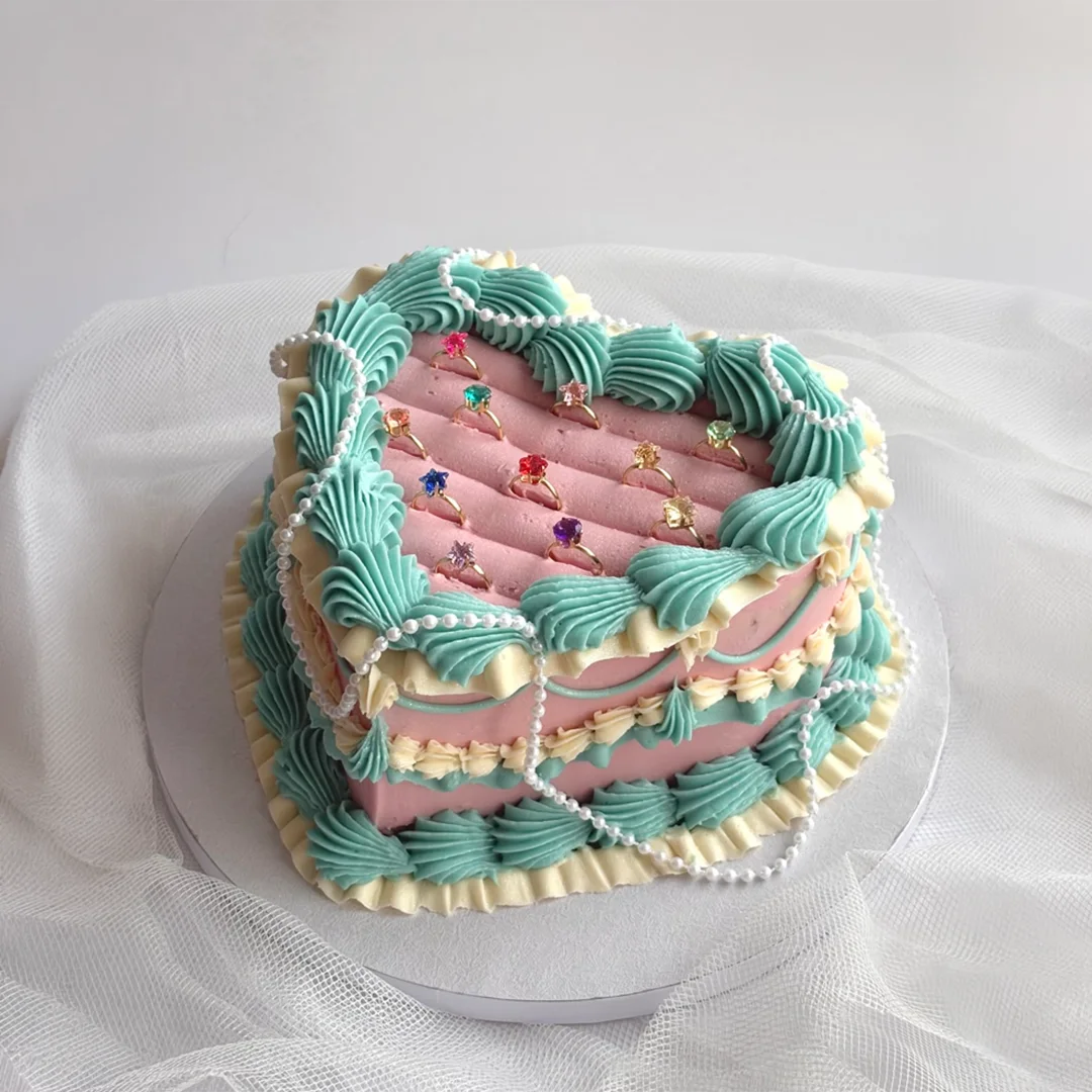 Heart-shaped cake with decorative frosting