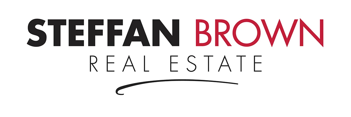 Steffan Brown Real Estate Logo Portrait of Sacramento City Councilmember Rick Jennings standing outside a building in a suit and tie