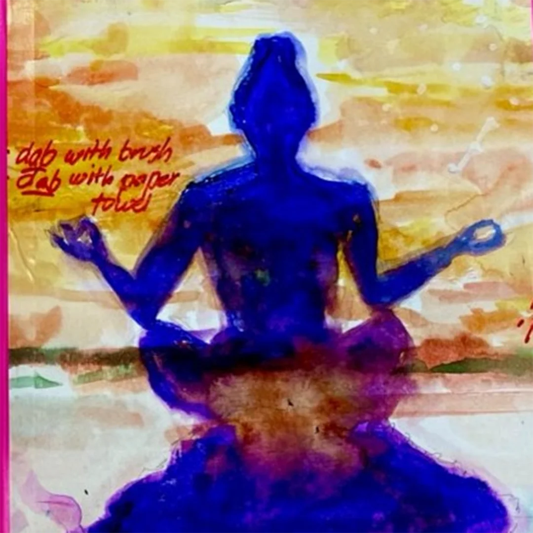 Silhouette meditating against colorful background