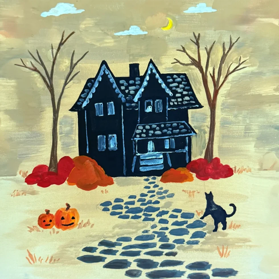 Haunted house with pumpkins and cat