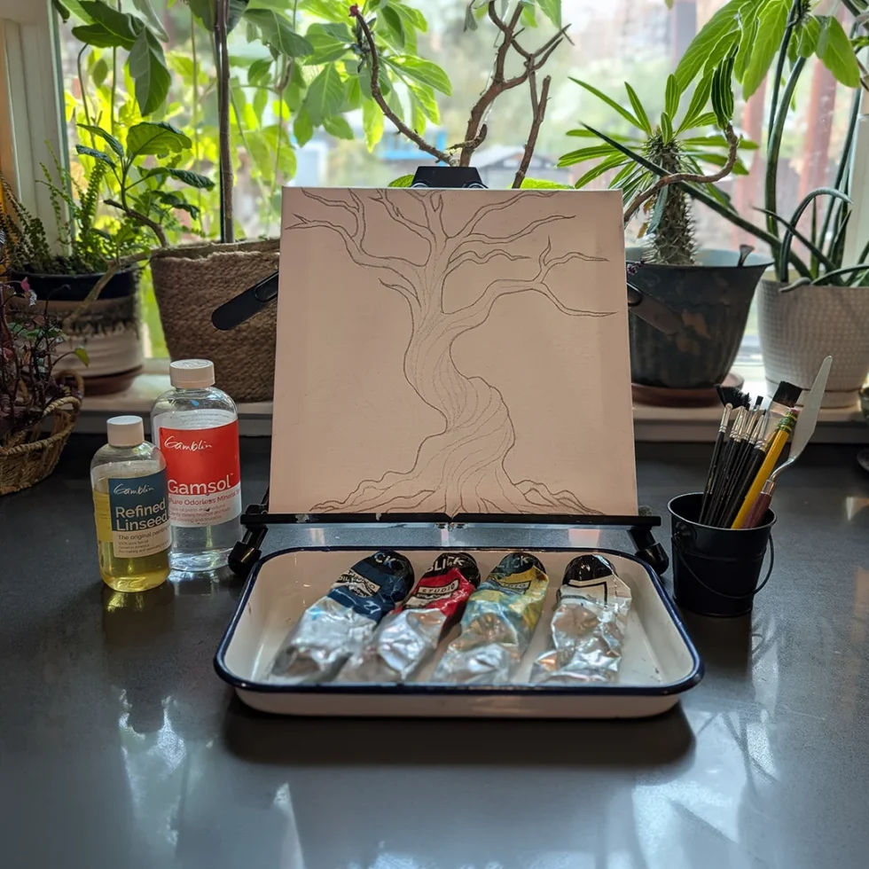 Canvas with tree sketch and paints